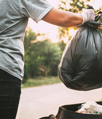 Private investigator retrieving garbage as potential evidence during investigations.